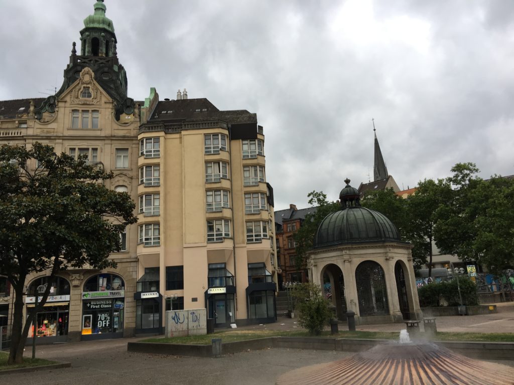 a fountain in front of a building