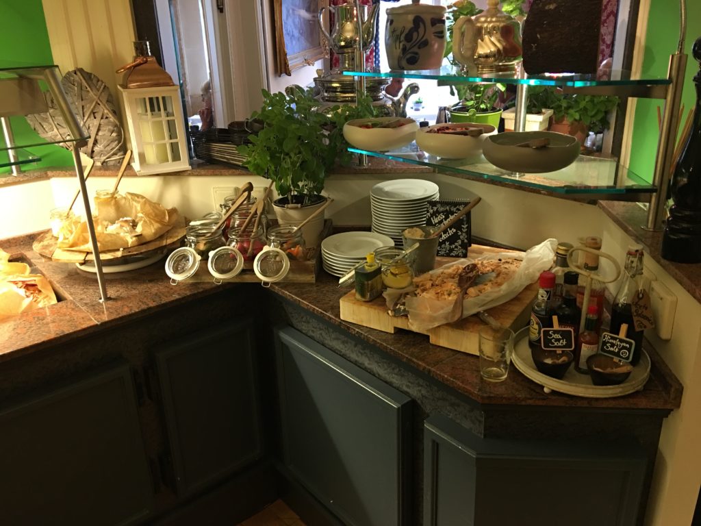 a kitchen counter with plates and food on it