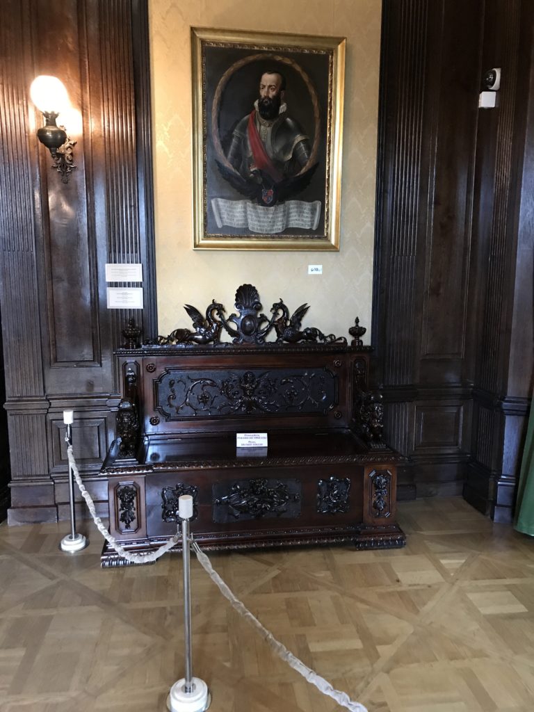 a painting of a man on a bench in a room