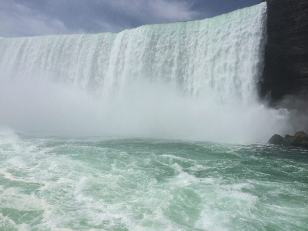 a waterfall with water splashing