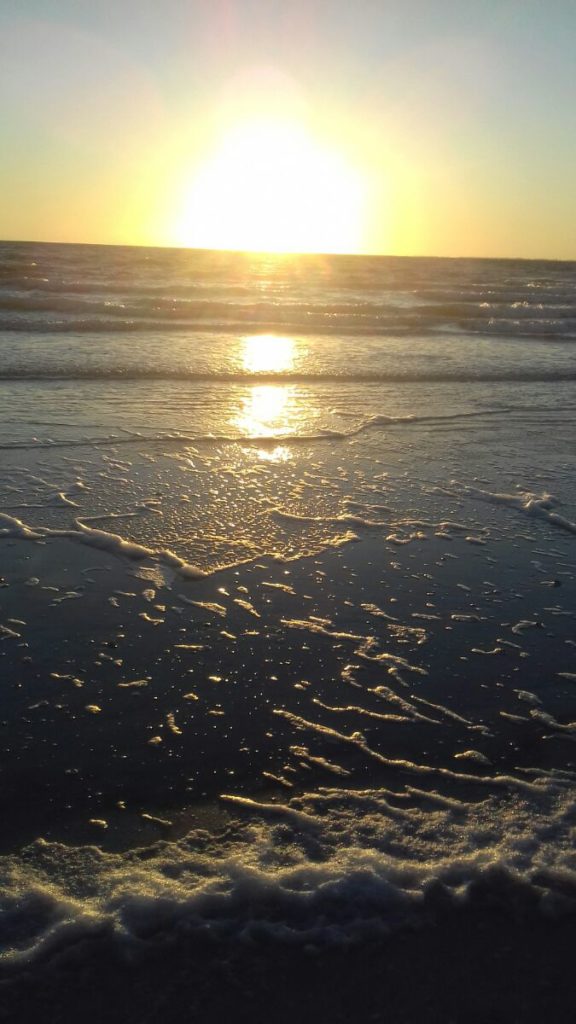 a sunset over a beach