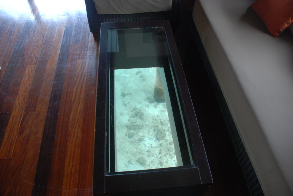a glass table with a fish tank