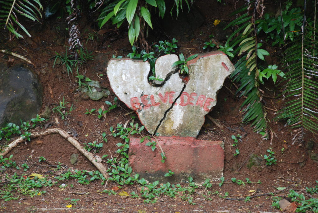 a broken stone with red writing on it