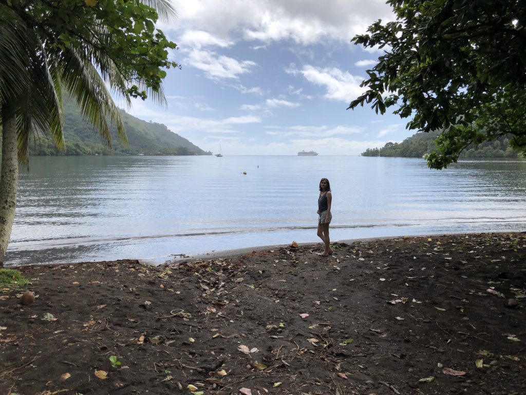a woman standing on a beach