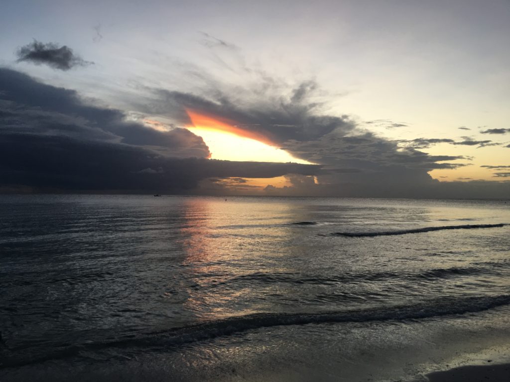 a sunset over a body of water