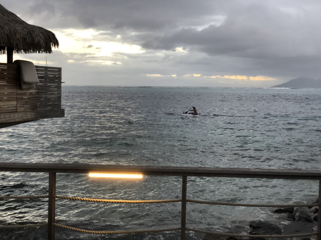 a person in a kayak in the ocean
