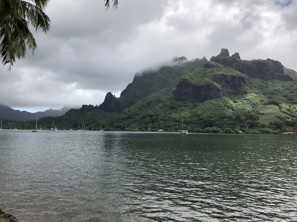 a body of water with mountains in the background