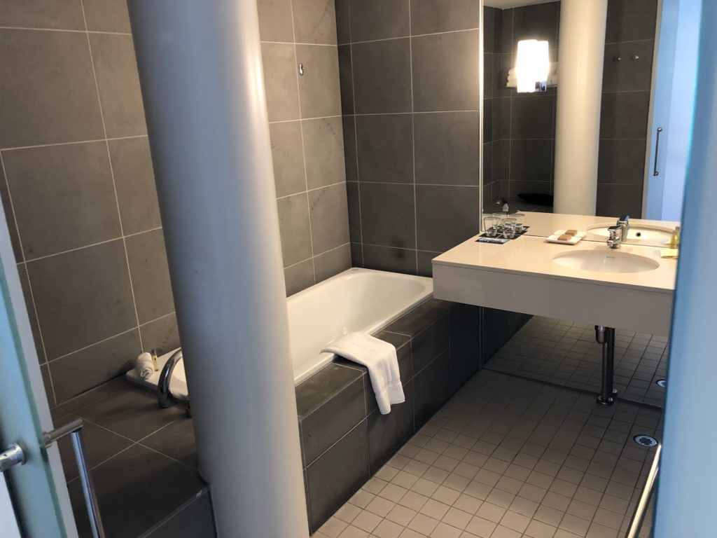 a bathroom with a tub and sink