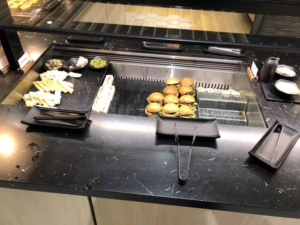 food on a counter with a tray of food