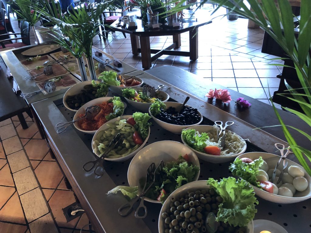 a buffet table with bowls of food