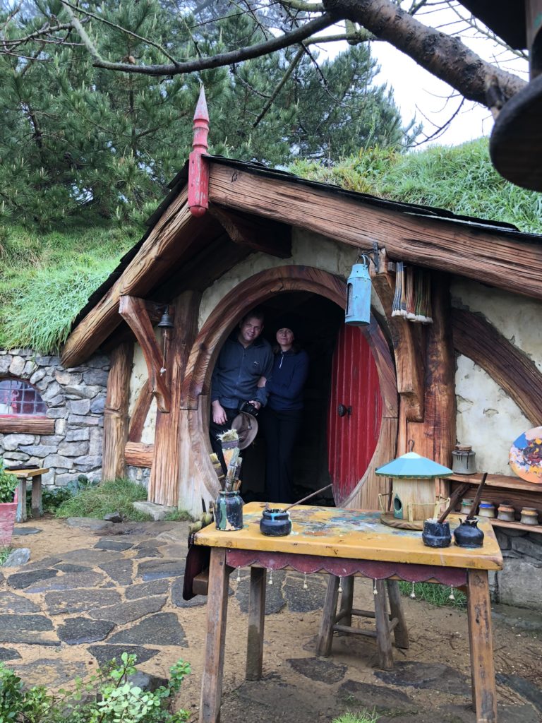 two people standing in a doorway of a house