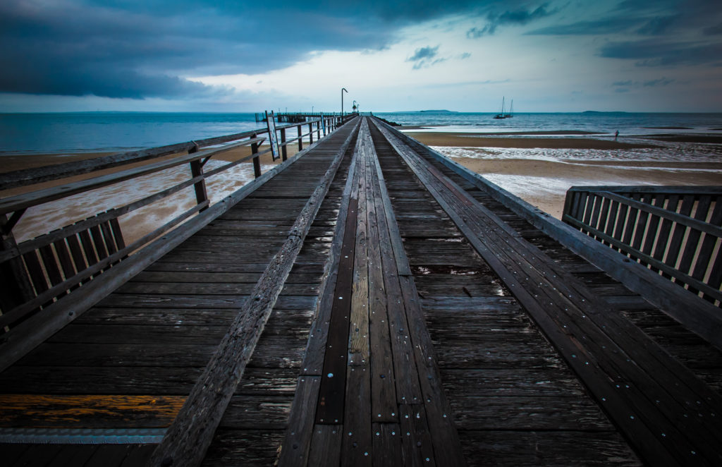 a wooden bridge over water