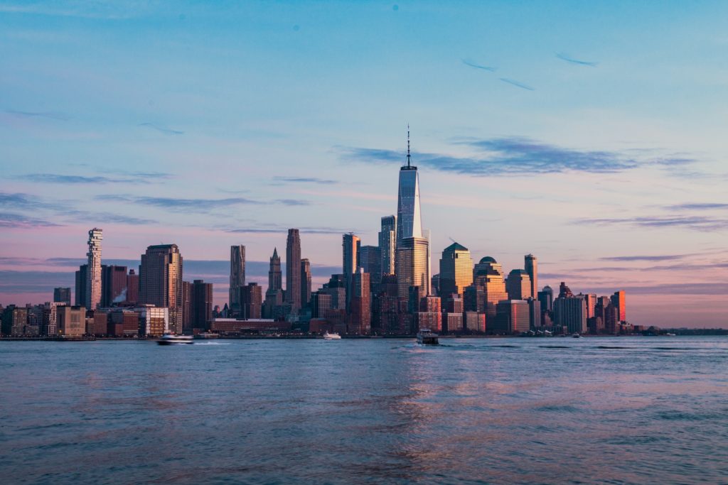 a city skyline with a body of water
