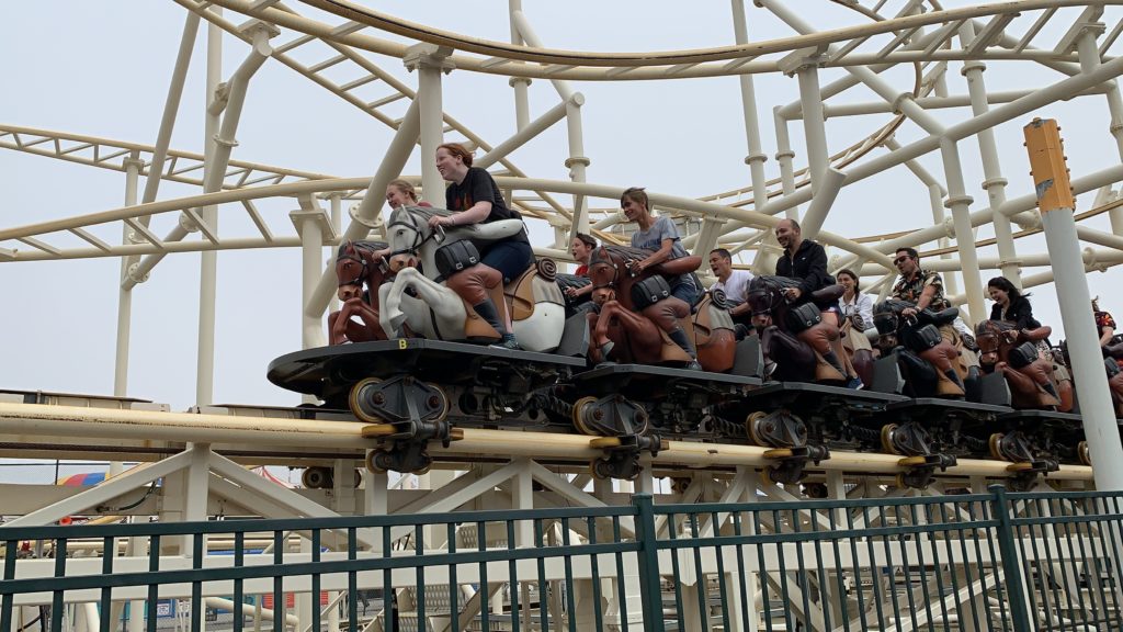 people riding on a roller coaster