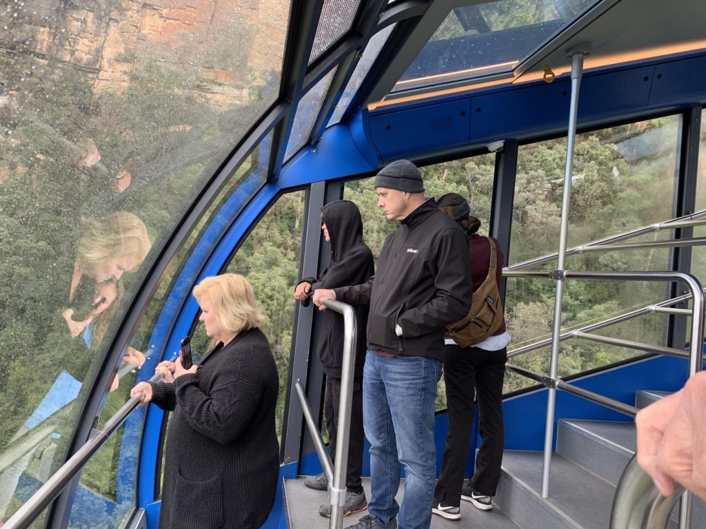 people standing on a gondola