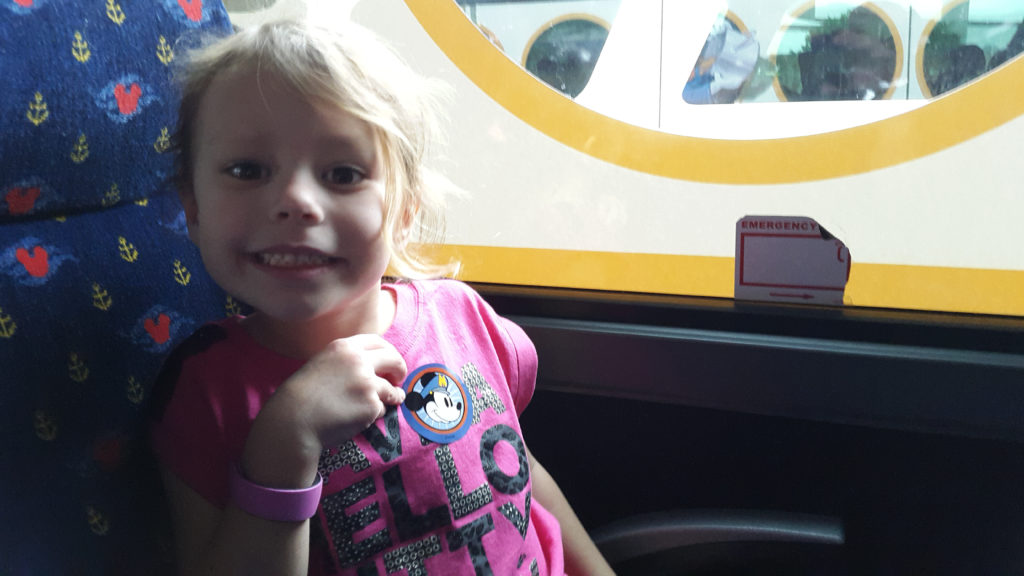 a girl sitting in a bus