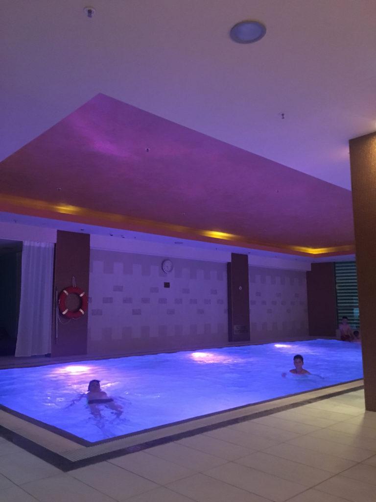 people in a large indoor pool