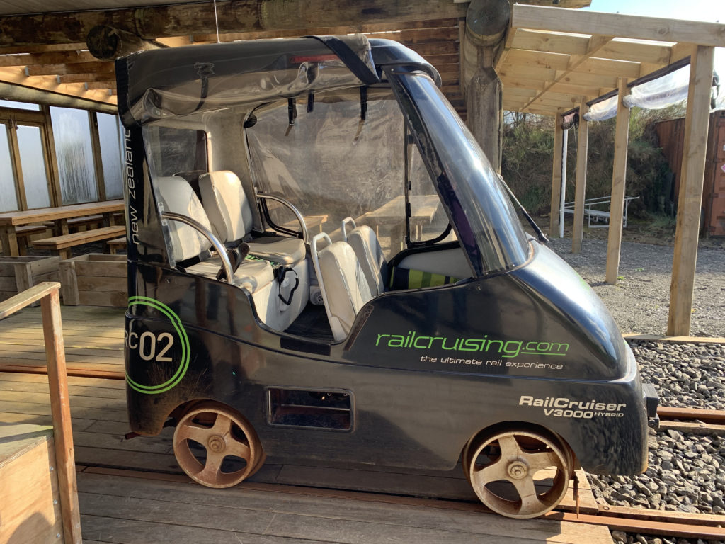 a small black vehicle with green text on it