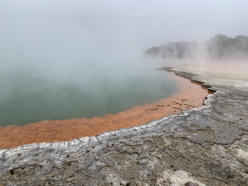 a hot spring with steam coming out of it