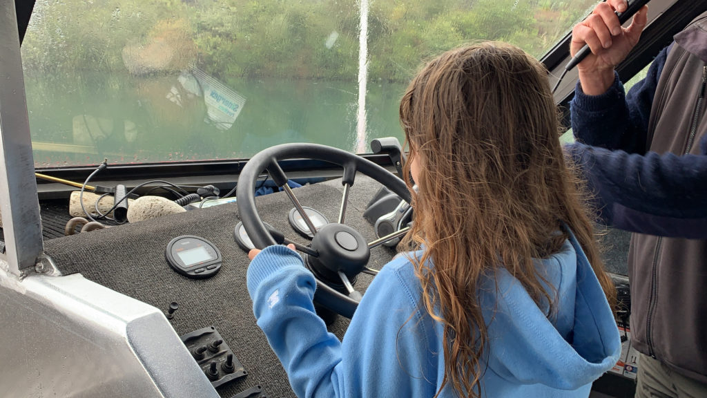 a girl driving a vehicle