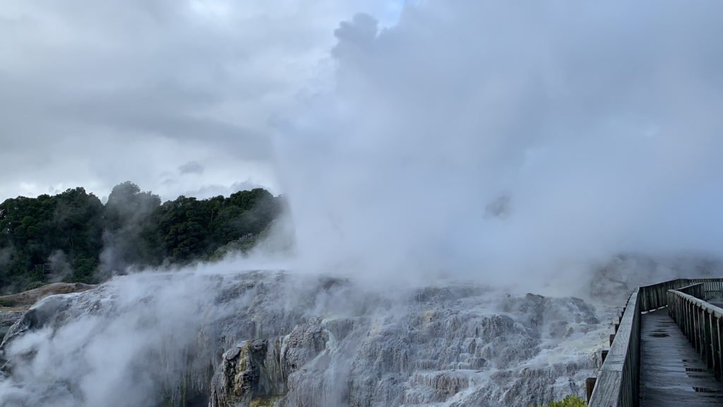 a rocky mountain with steam coming out of it