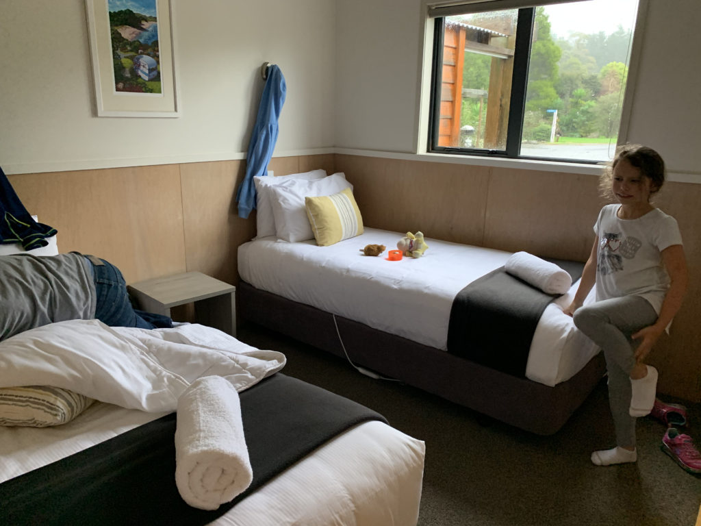 a room with two beds and a window