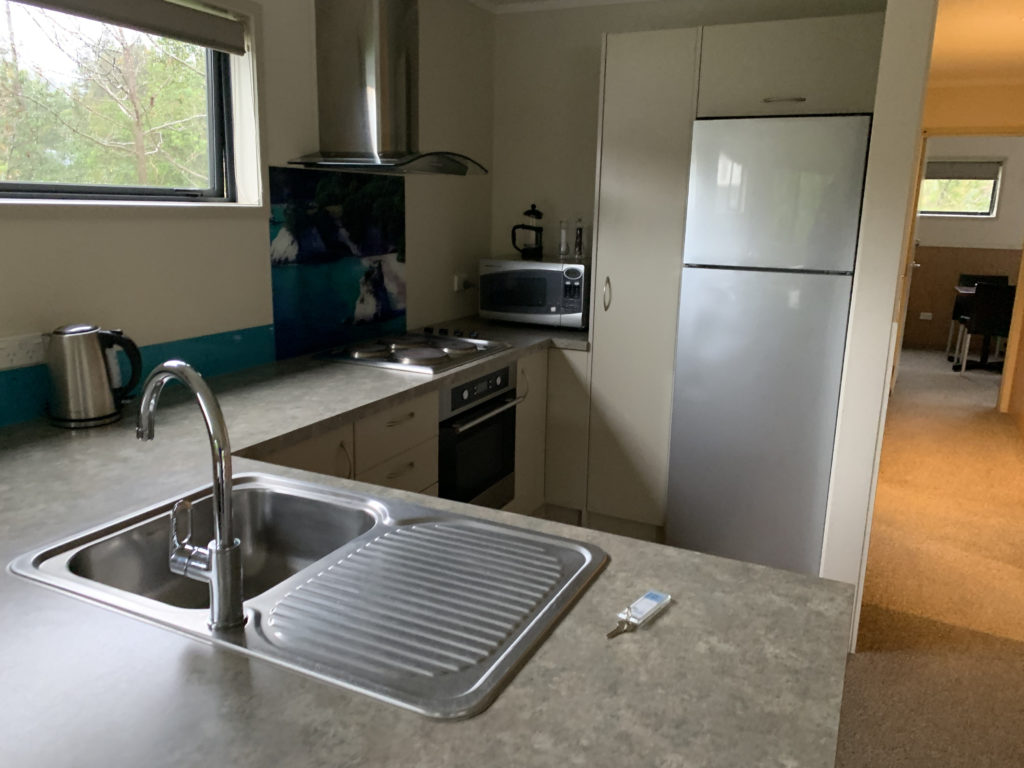 a kitchen with a sink and a refrigerator