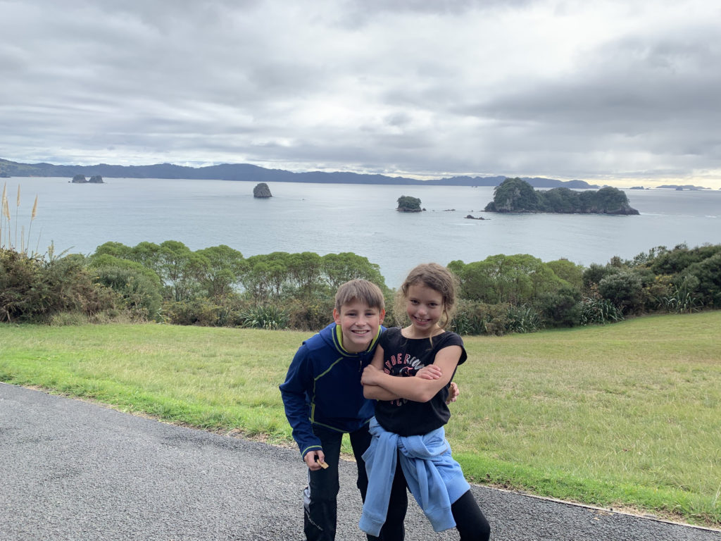 a boy and girl posing for a picture