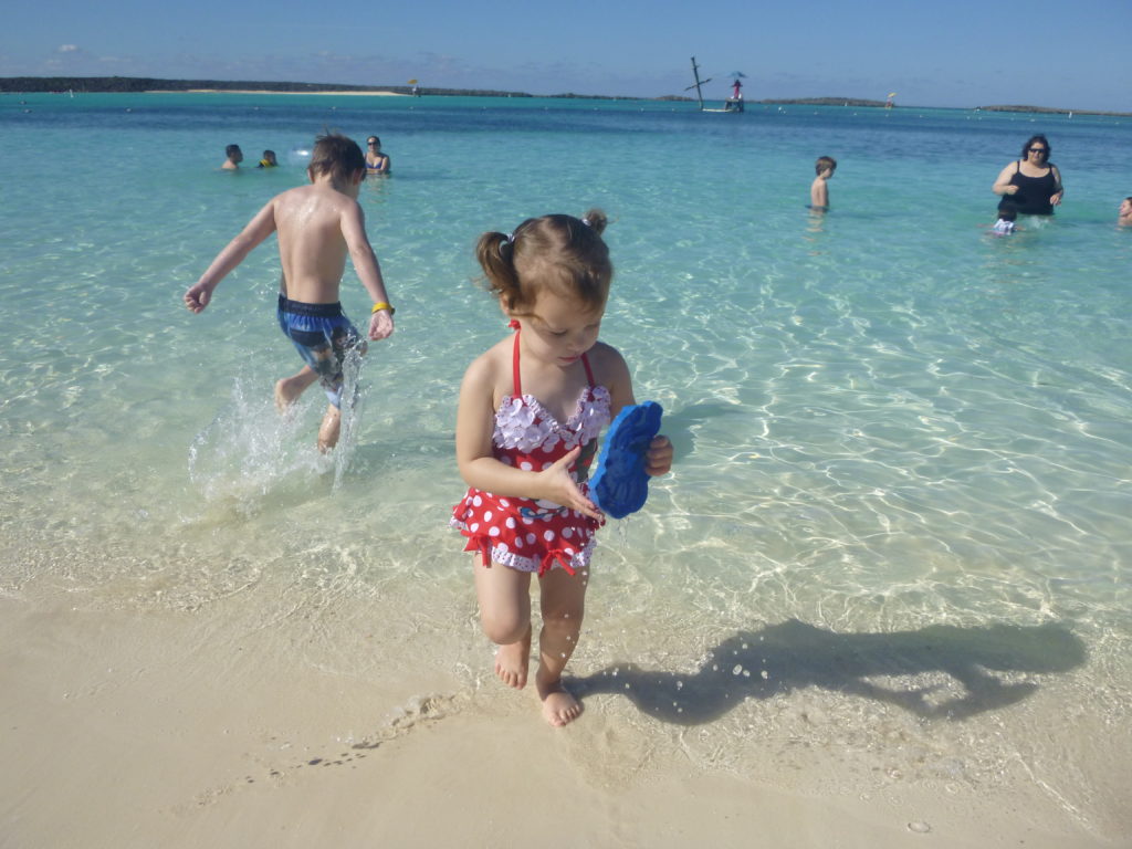 a group of kids playing in the water