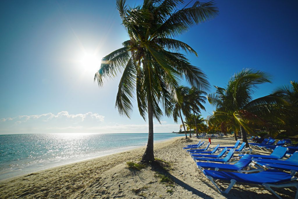 a group of chairs on a beach