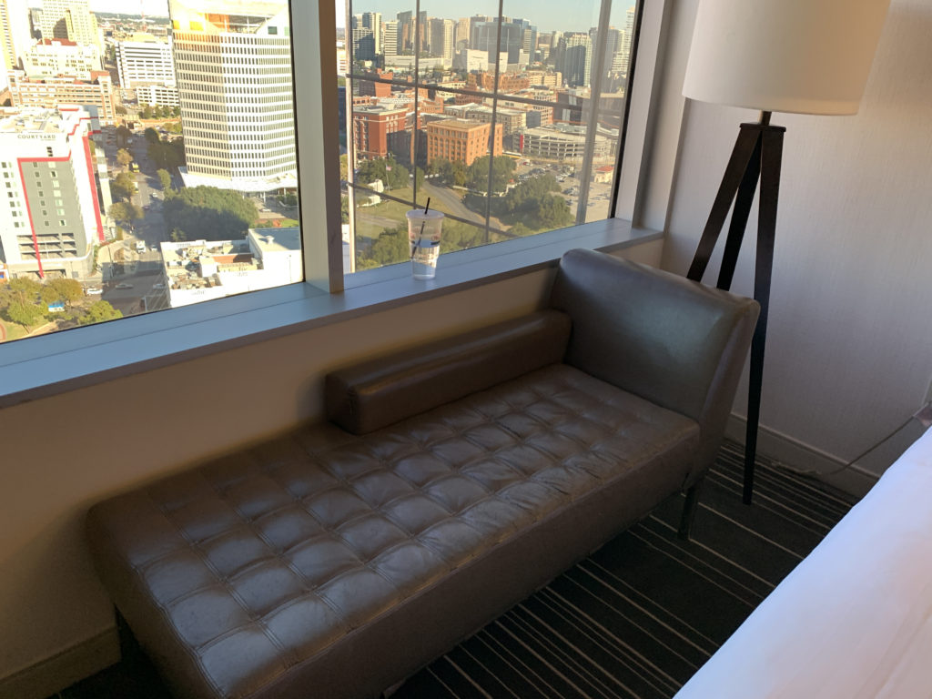 a couch next to a window