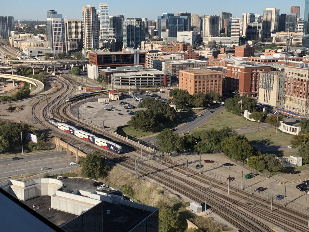 a train on the tracks in a city