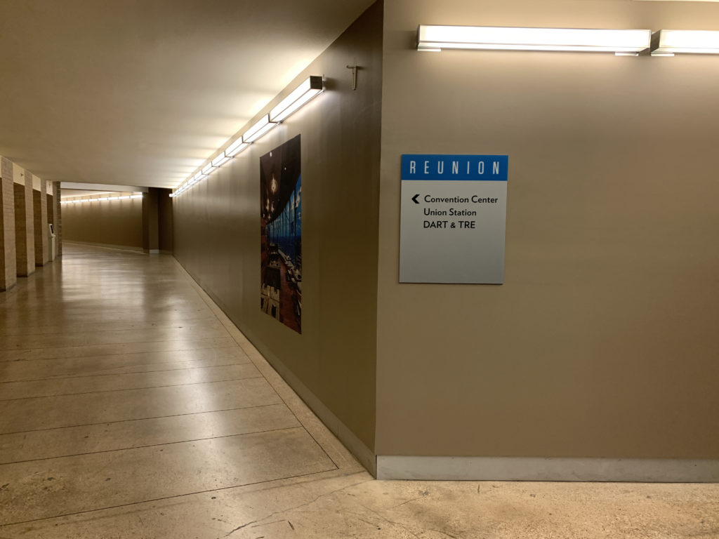 a hallway with a sign on the wall