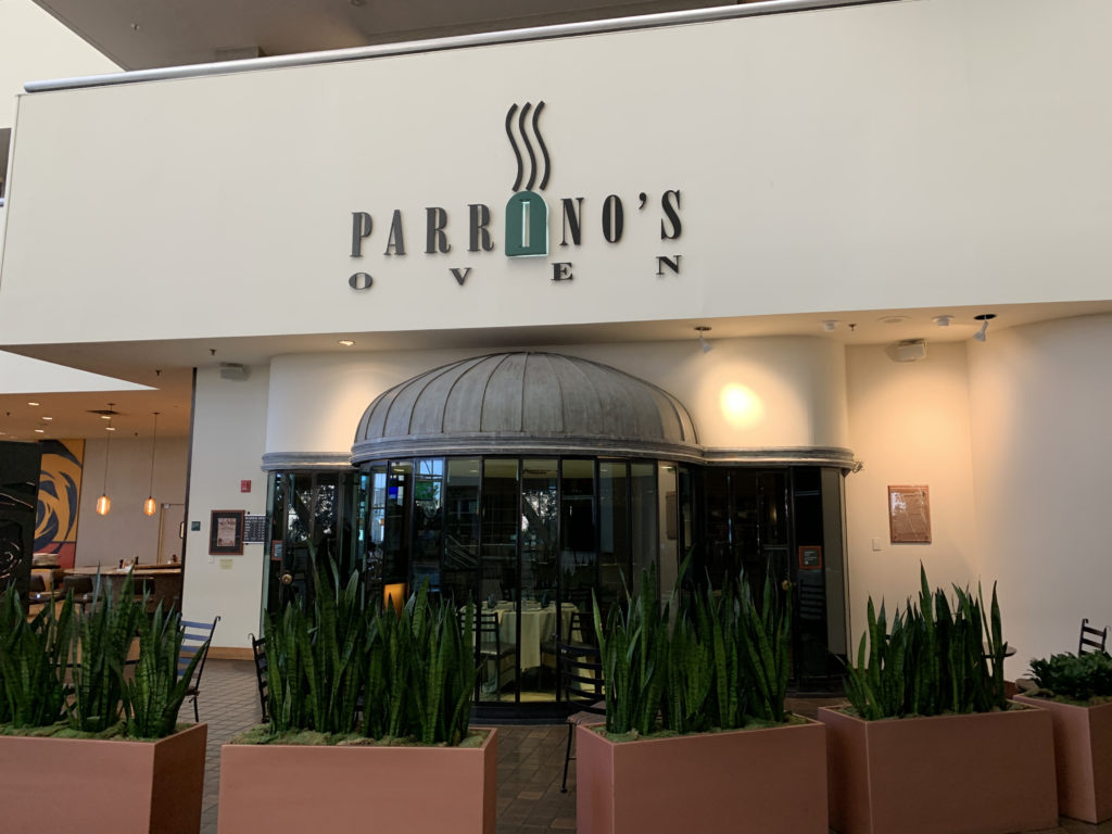 a restaurant with a sign on the front
