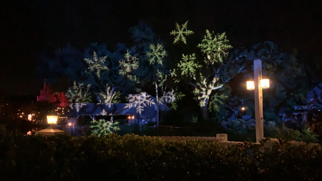 a house with snowflakes on it at night