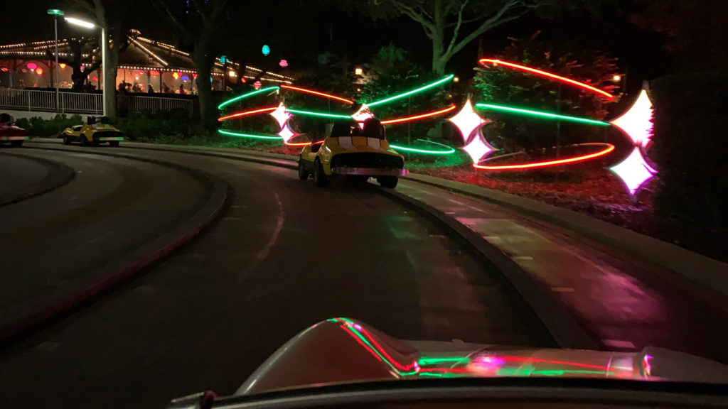 a car driving on a road with lights
