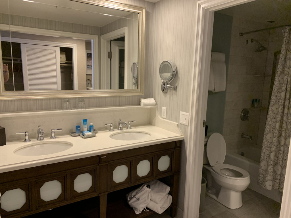 a bathroom with a mirror and sink