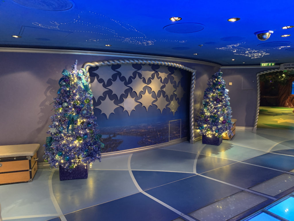 a room with christmas trees and lights