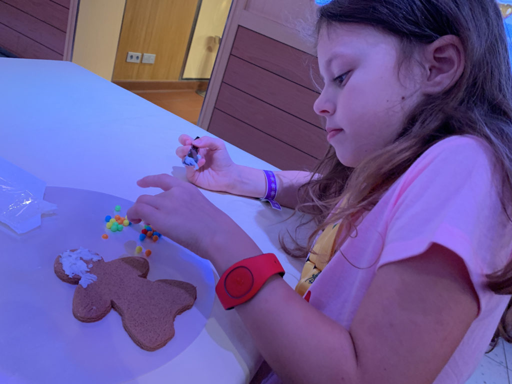 a girl making a gingerbread man