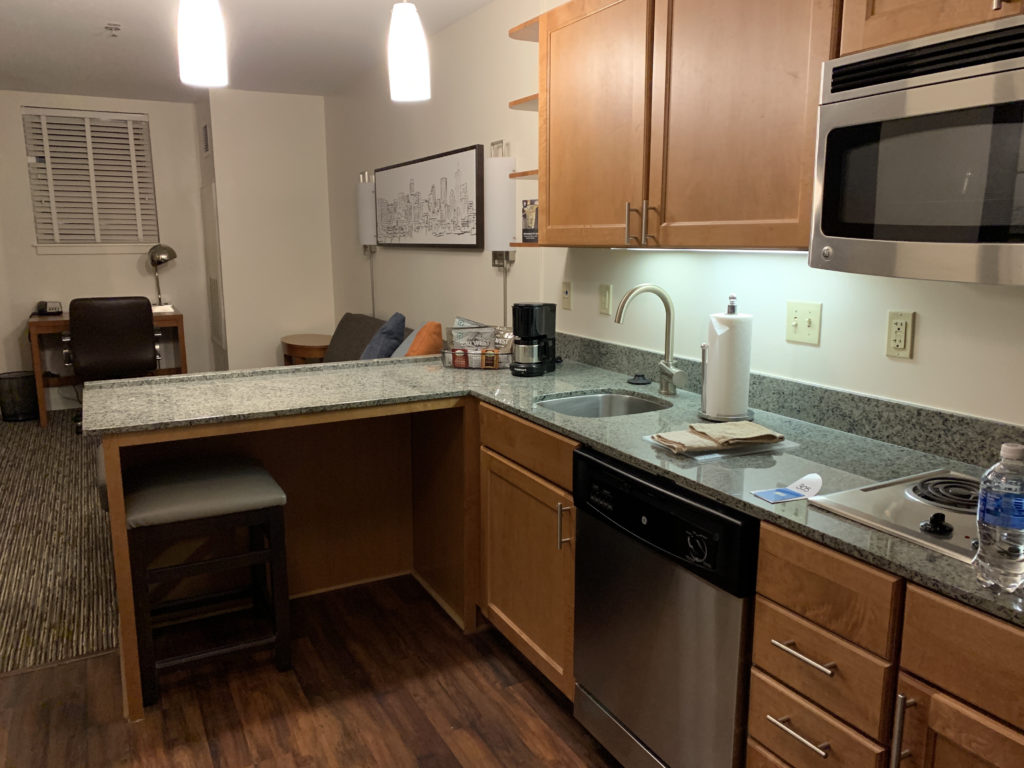 a kitchen with a counter top and a microwave