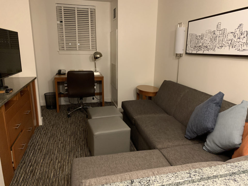a couch and ottoman in a room