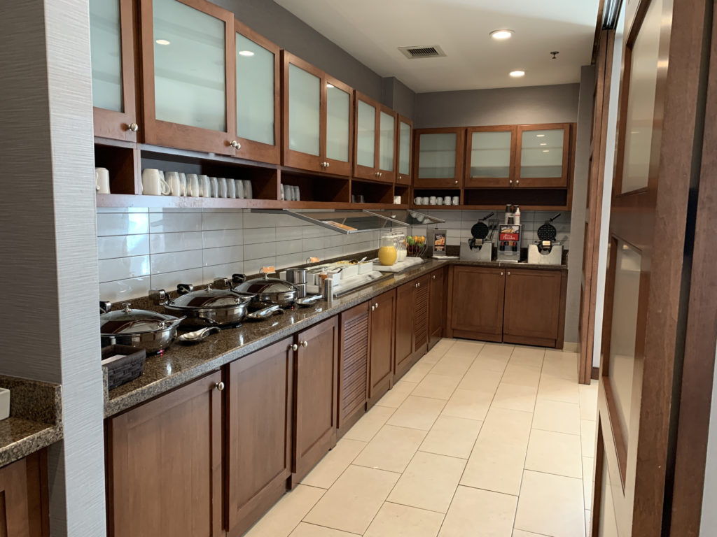 a kitchen with many pans and pots