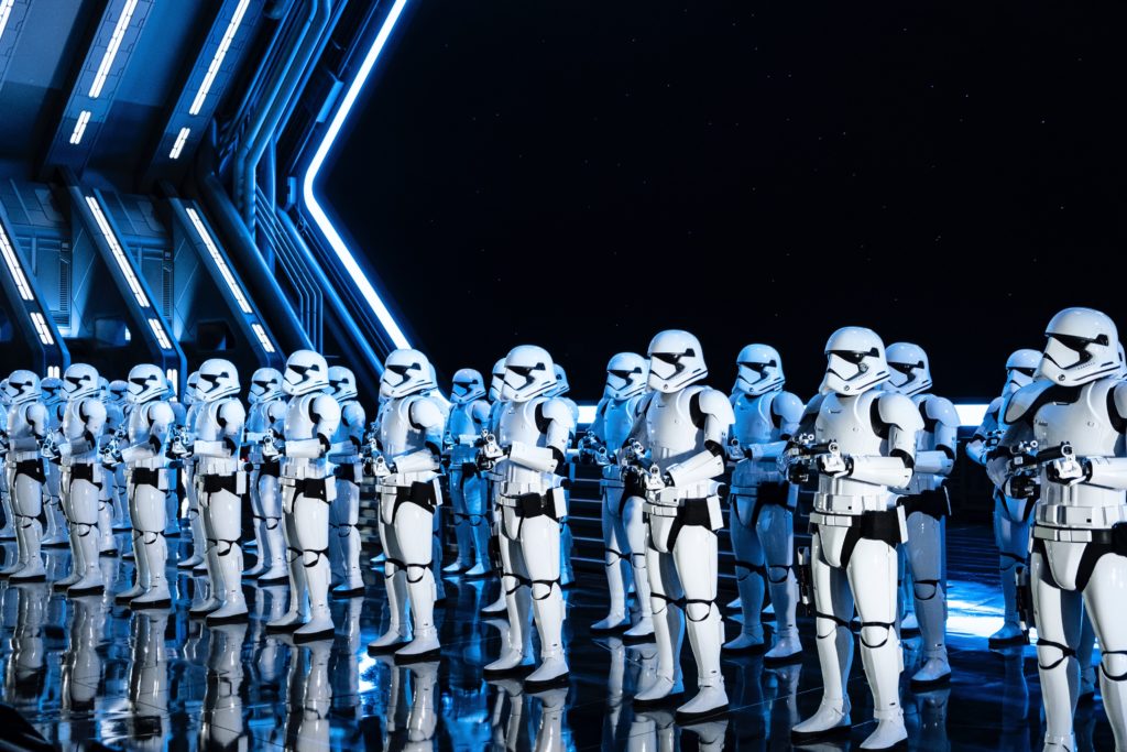 a group of people in white clothing