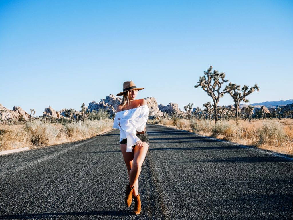 a woman posing on a road