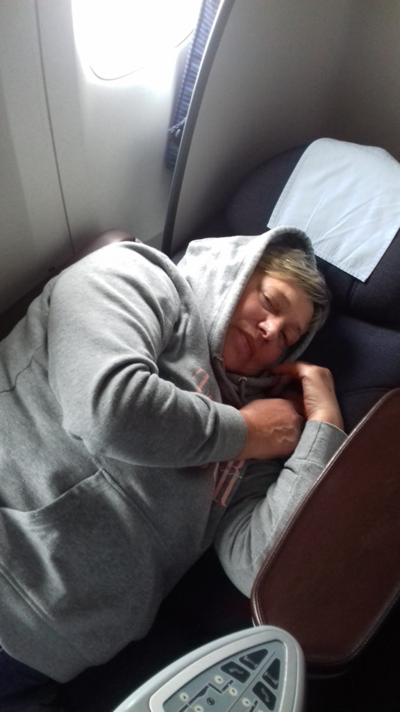 a woman sleeping on a chair