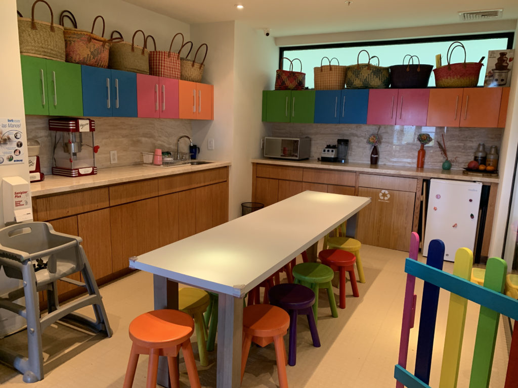 a kitchen with a table and chairs