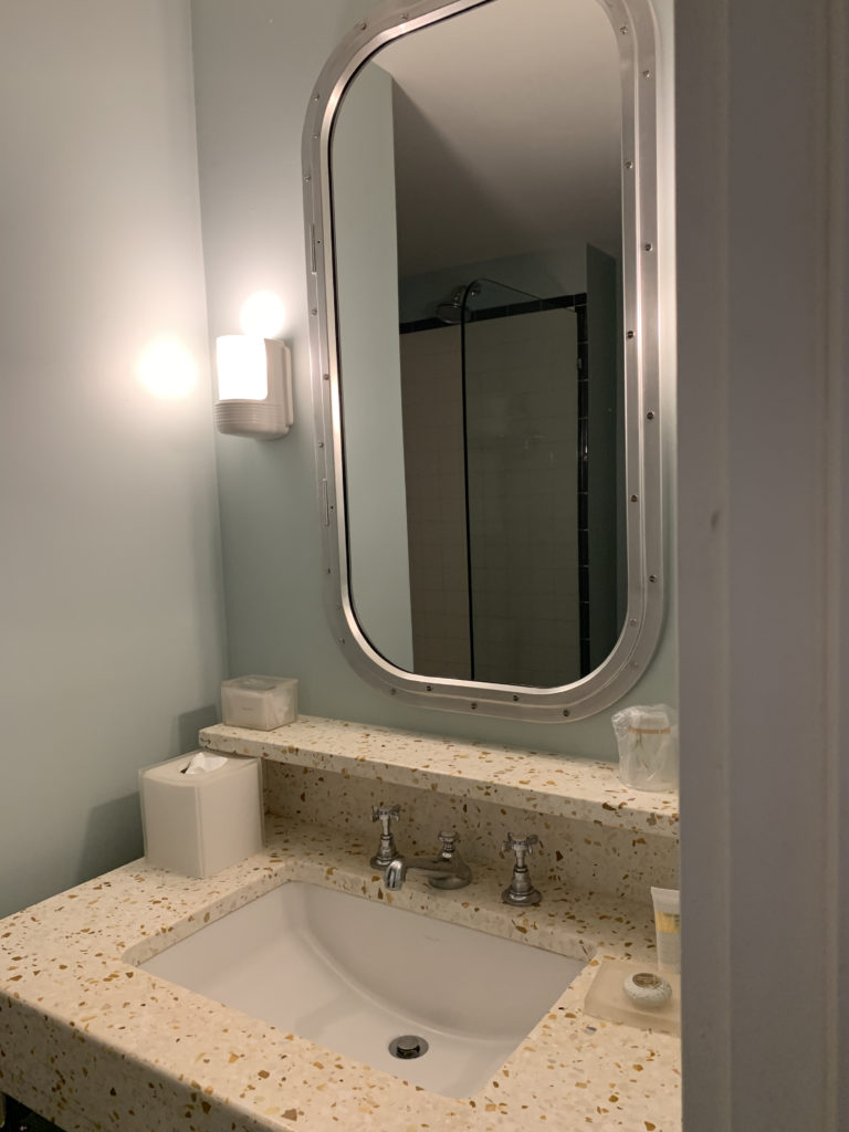 a mirror above a sink