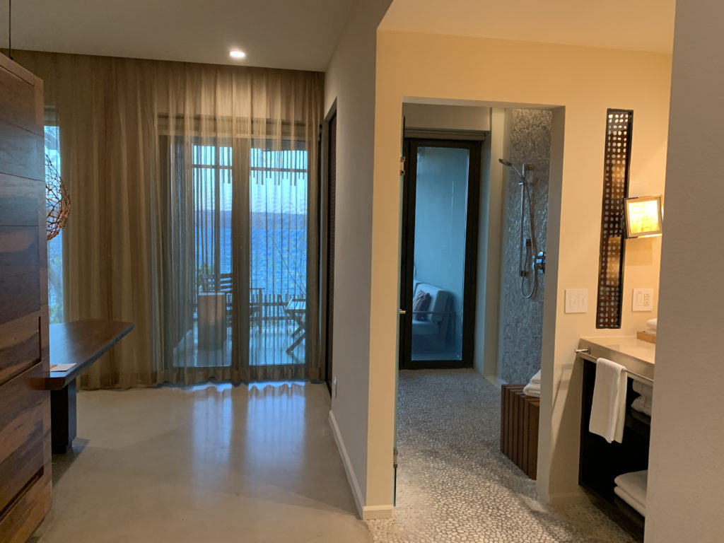 a bathroom with a shower and a door