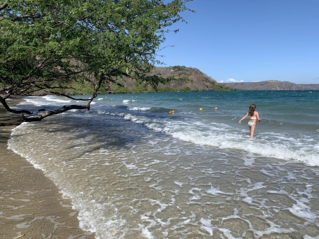 a girl in a bathing suit in the water