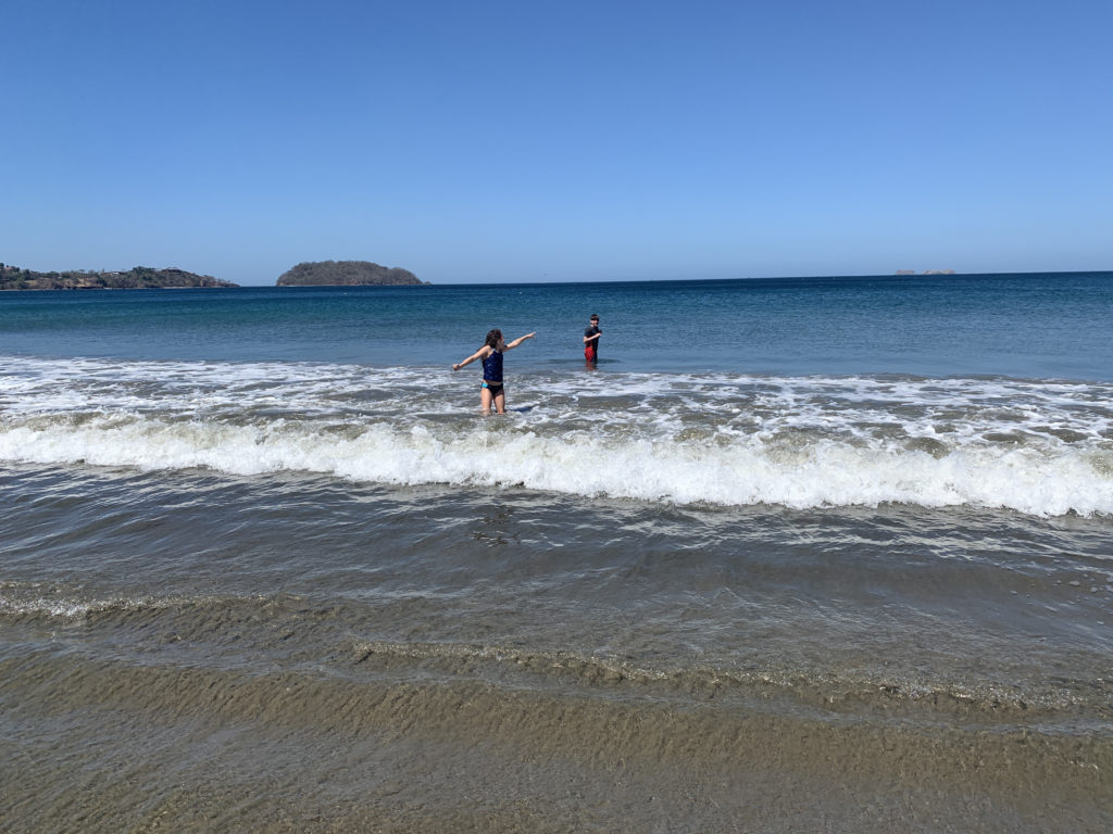 a couple of people standing in the water